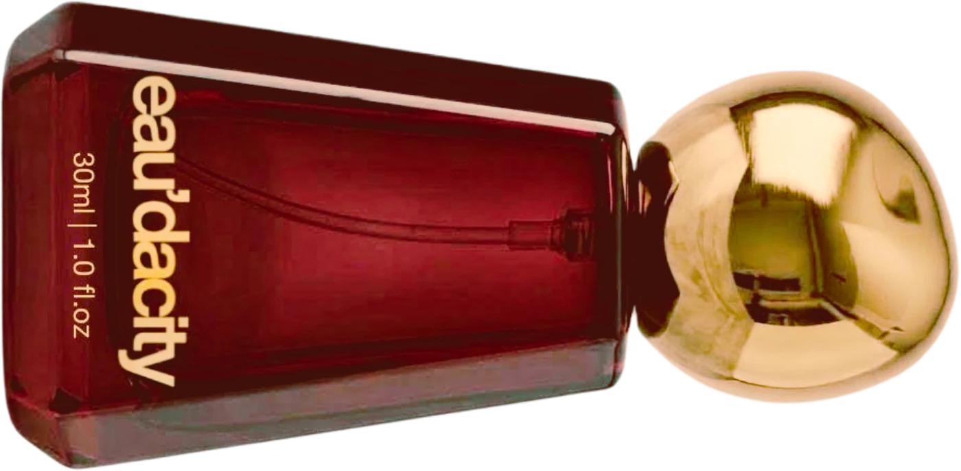 The Eau’dacity icon bottle in garnet glass with a gold ball cap